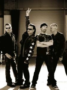 Bono puts his hand up to attract the teachers attention as he desperately needs to pee