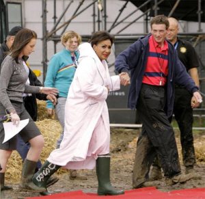 Dame Shirley enters the mud wrestling ring at Glastonbury in 2005