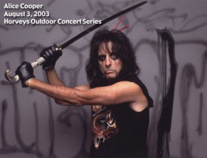 AliceCooper Alice warns the unruly fan that if he hit's anyone esle with his false leg he'll cut the other one off too!